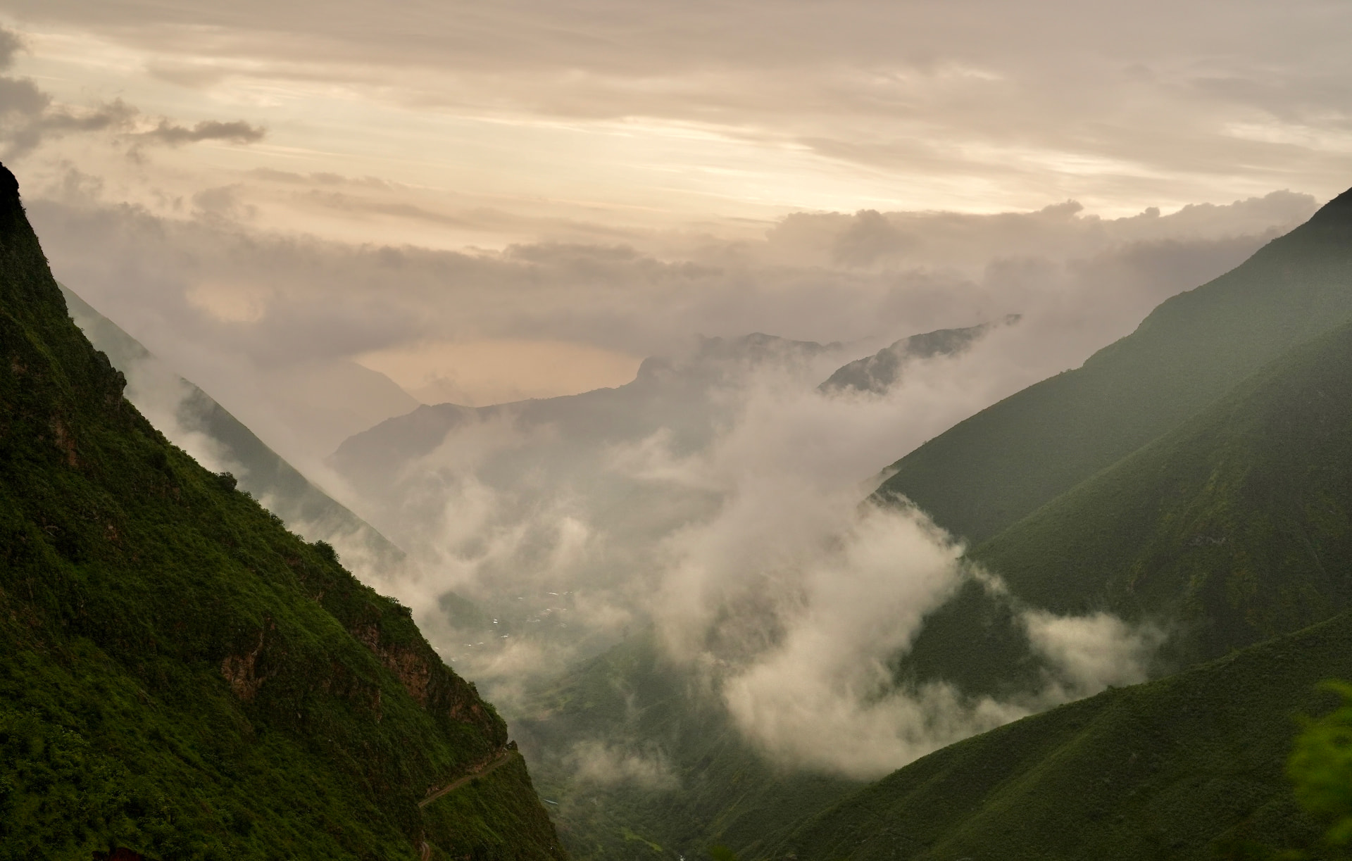 A mountain path disappearing into cloud